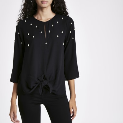 Zwarte verfraaide top met strik voor