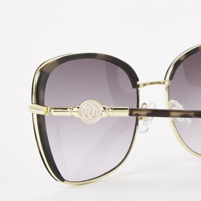 Brown tortoiseshell metal trim sunglasses