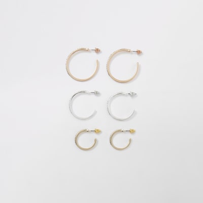 Set met oorringen in verschillende kleuren en siersteentjes