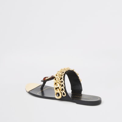 Schwarze Sandalen mit Zehensteg