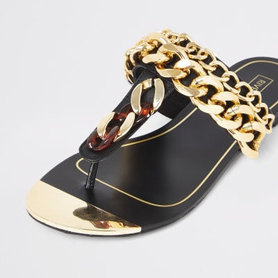 Sandales noires à entredoigt avec chaînes