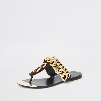 Sandales noires à entredoigt avec chaînes