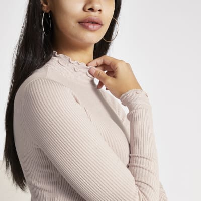 Lichtroze geribbelde gebreide top met lange mouwen met ruches