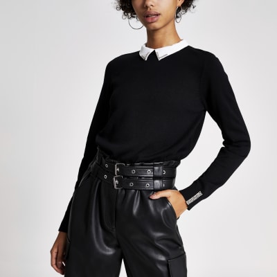 Schwarzes, langärmeliges Strickoberteil mit strassverziertem Kragen