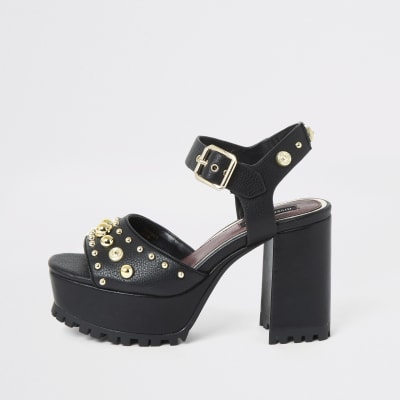 Zwarte sandalen met studs en plateauzolen met profiel