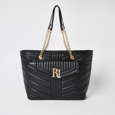 Schwarze, gesteppte Schultertasche