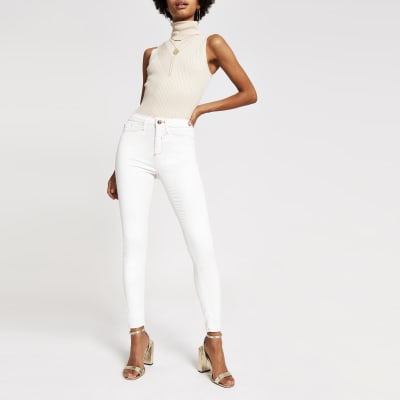 Molly - Gebroken witte jegging met coating en halfhoge taille
