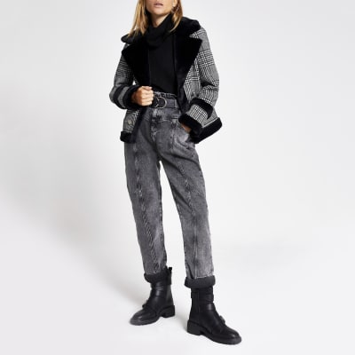 Schwarze Jacke mit Hahnentritt-Muster und Kunstfellbesatz