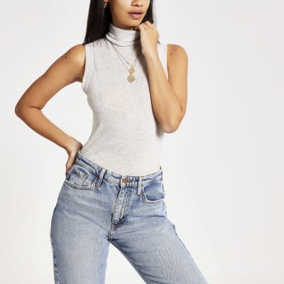 Beige aansluitende mouwloze top met col 