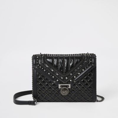 Black quilted stud detail cross body bag | River Island