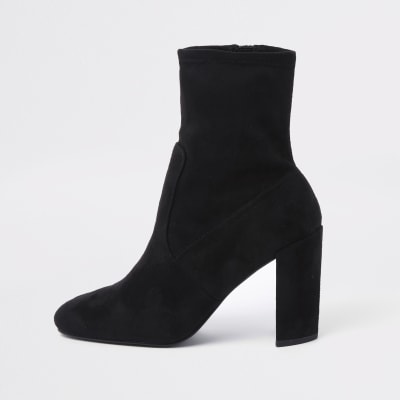 Bottes moulantes noires à talons