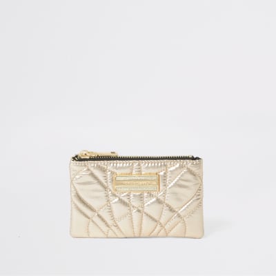 Goudkleurig doorgestikt mini-tasje met rits
