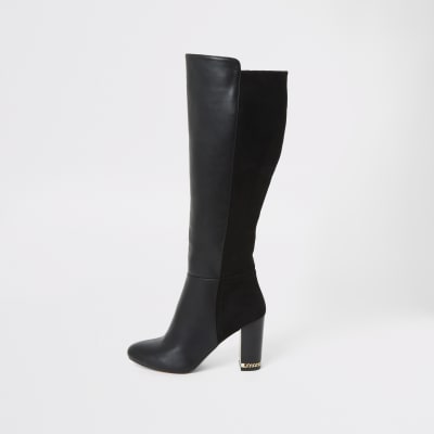 Black knee high heeled boots