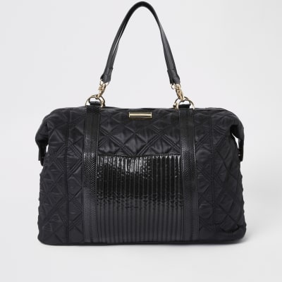Black quilted weekend travel bag River Island