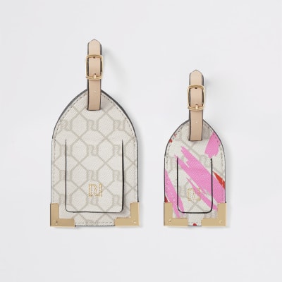 Set met roze bagegelabels met RI-monogram