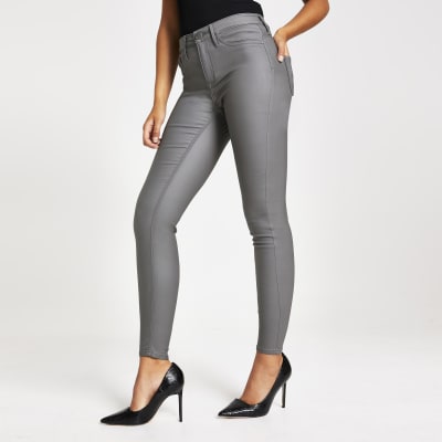 Molly - Grijze jegging met coating en middelhoge taille