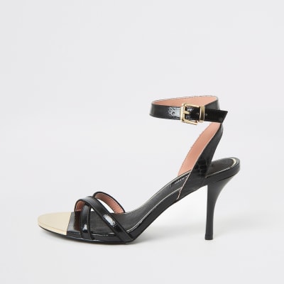 Schwarze Riemchensandalen mit überkreuzten Riemen und Bleistiftabsatz