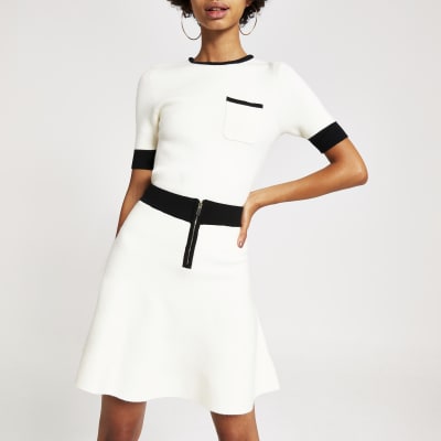 Crème gebreide minirok met contrasterende bies