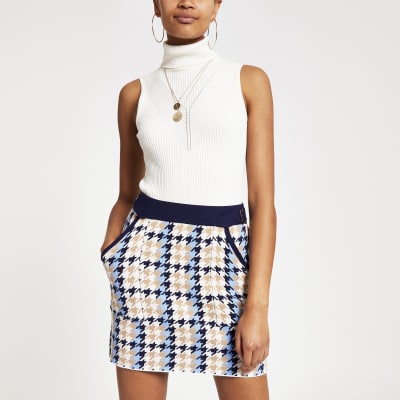 Zwarte geruite en gebreide utility-minirok