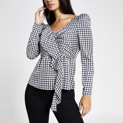 Zwarte top met lange mouwen en hanevoet print