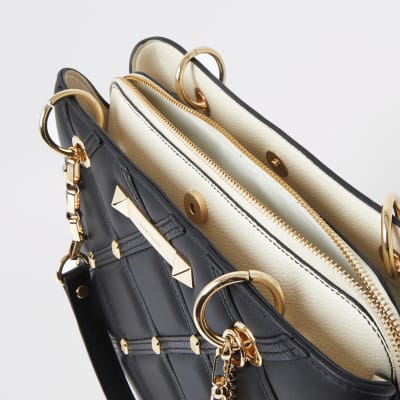 Black quilted studded tote bag