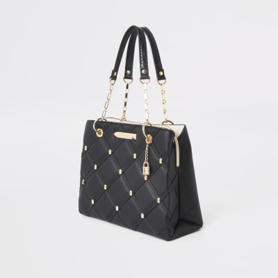 Black quilted studded tote bag