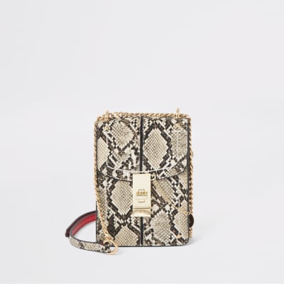 Beige snake print lock front cross body bag