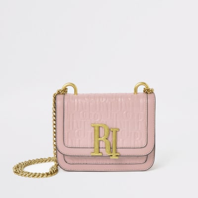 Lichtroze kleine crossbodytas met RI-logo in reliëf
