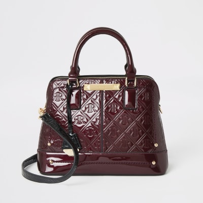 Rode crossbodytas met RI in reliëf