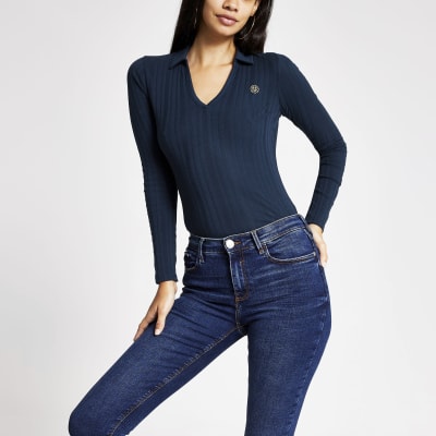 Marineblauwe geribbelde top met lange mouwen en kraag