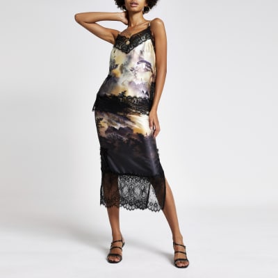 Zwarte midirok met print en kant