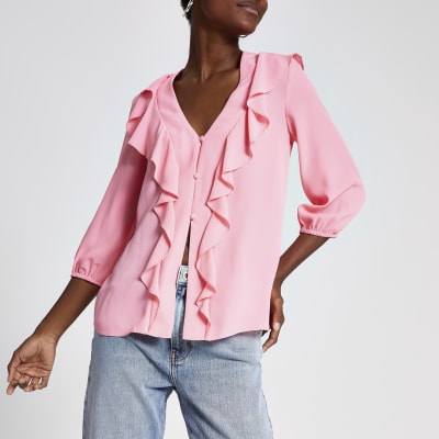 Roze blouse met ruches voor