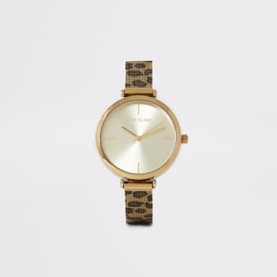 Montre dorée à bracelet en résille imprimé léopard