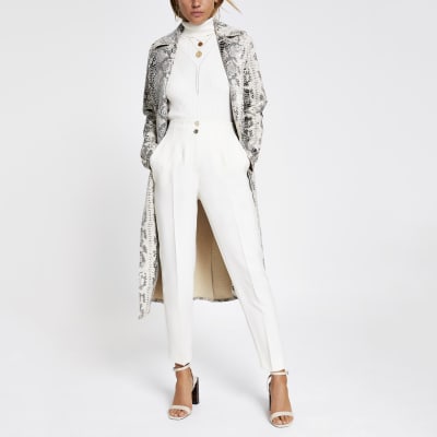 Crèmekleurige broek met hoge taille en smalle pijpen tot de enkel