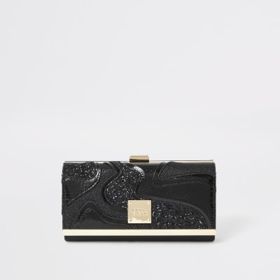 Porte-monnaie noir pailleté avec empiècements à paillettes et fermoir clip