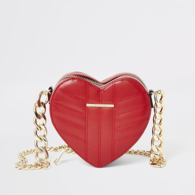 Red quilted heart shaped cross body bag | River Island