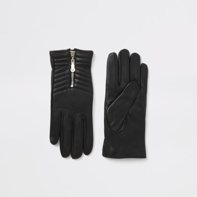 Schwarze, gesteppte Lederhandschuhe mit Reißverschluss in einer Box