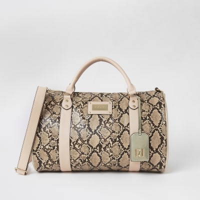 Beige weekendtas met slangenprint