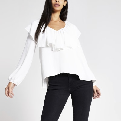 Witte top met lange mouwen en ruche V-hals