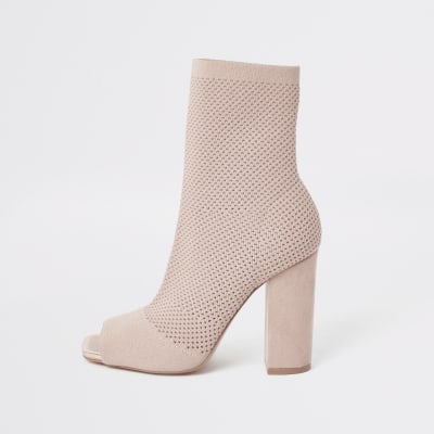 Pinke Sock-Stiefel mit Lochstrickmuster und weiter Passform