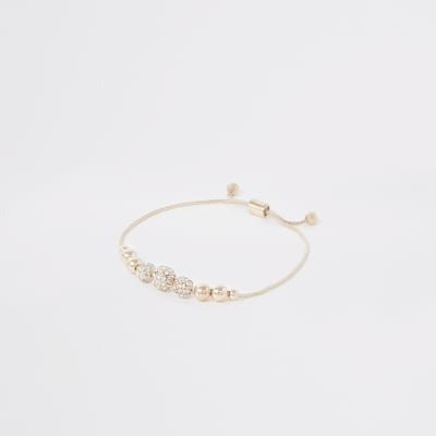 Roségouden armband met kralen en siersteentjes