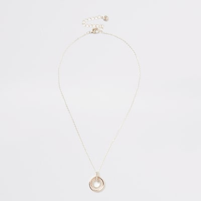 Roségouden ketting met cirkel met siersteentjes