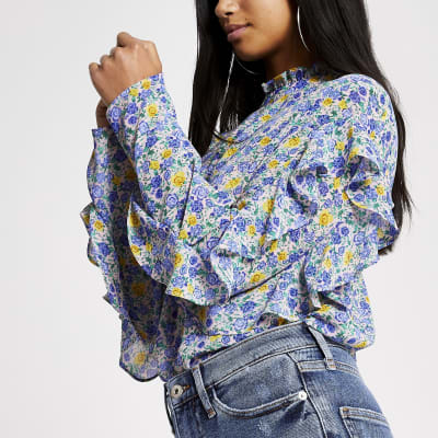 RI Petite - Blauwe ruches top met print en lange mouwen