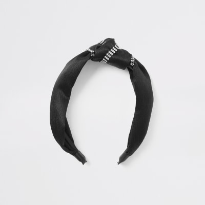 Zwarte hoofdband met knoop omringd met siersteentjes