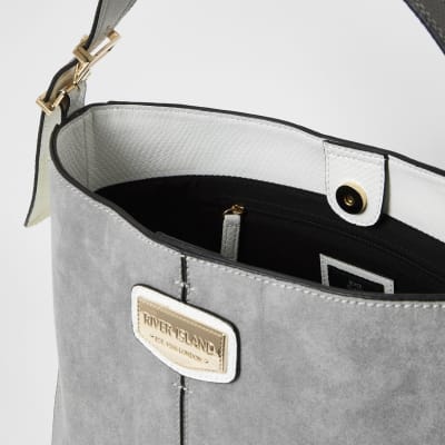 Grey suedette padlock side slouch bag