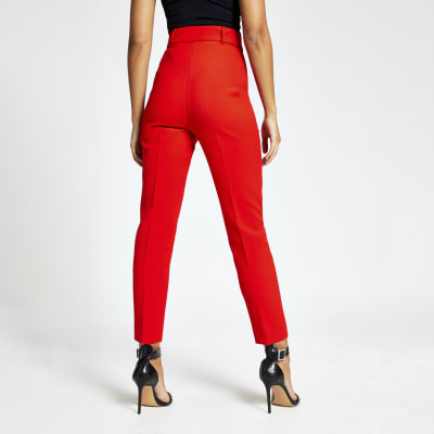 Red belted high rise peg trousers