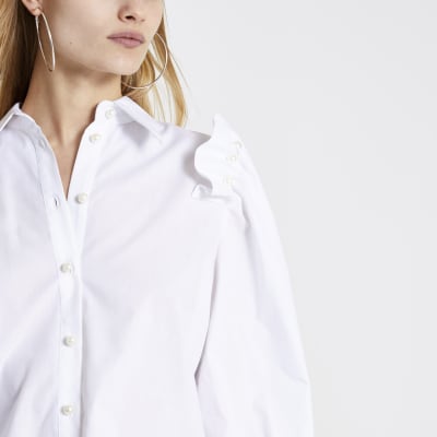 White pearl frill shoulder long sleeve shirt