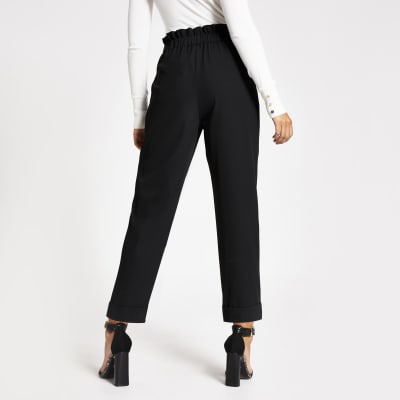 Black button waist peg trousers