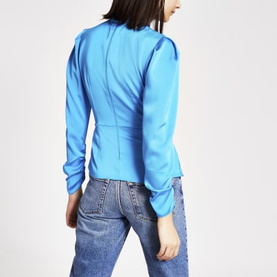 Bright blue high twisted neck blouse
