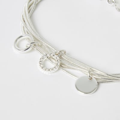 Zilverkleurige gelaagde armband met hangers en siersteentjes